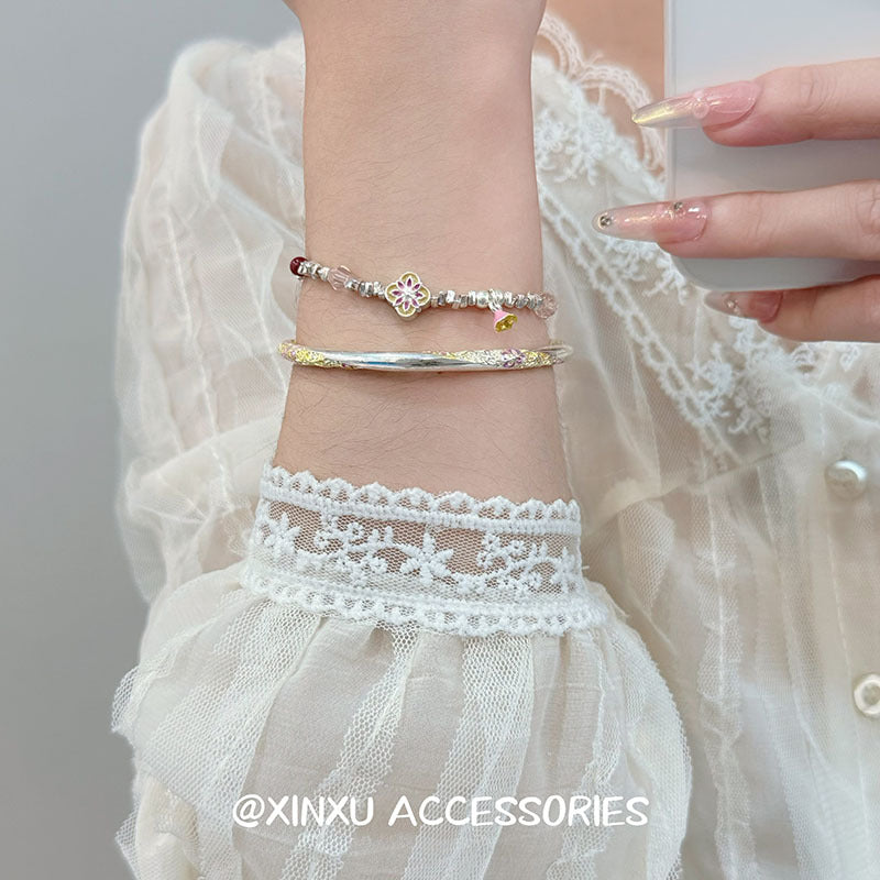 Modern Chinoiserie Floral Sliced Silver Bead Designer Bracelet — shop and try on with AI characters